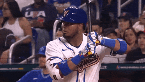 A Baseball Player With The Word Milwaukee On The Front Of His Jersey GIF