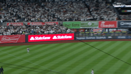 a baseball stadium with a budweiser ad on the wall