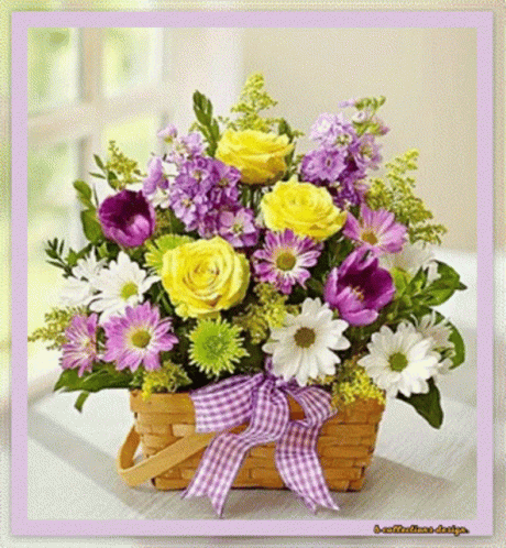 A Basket Filled With Yellow And Purple Flowers GIF