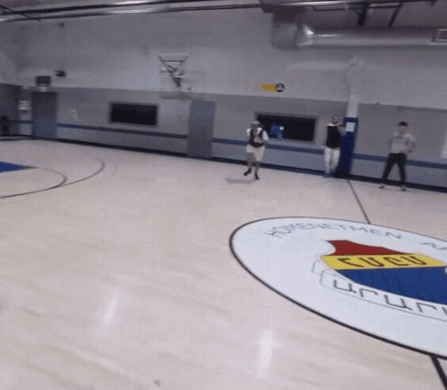 A Basketball Court With A Logo For Homenetmen On It GIF