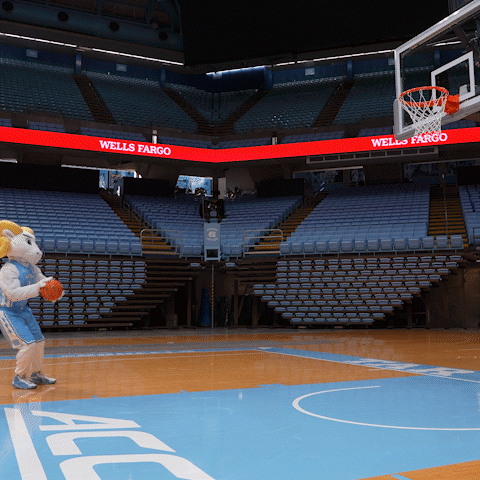 a basketball court with a wells fargo sign above it