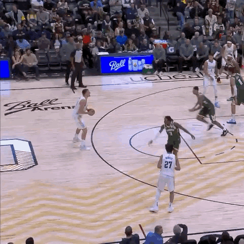 A Basketball Game Being Played At The Ball Arena GIF