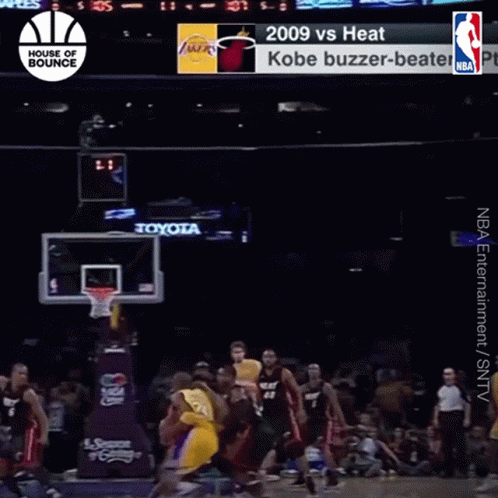 A Basketball Game Between The Heat And The Lakers Is Being Played GIF