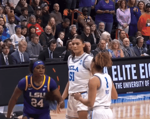 a basketball game between ucla and lsu is being played in front of a crowd
