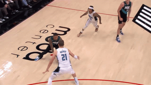 A Basketball Game Is Being Played At The Magic Center GIF