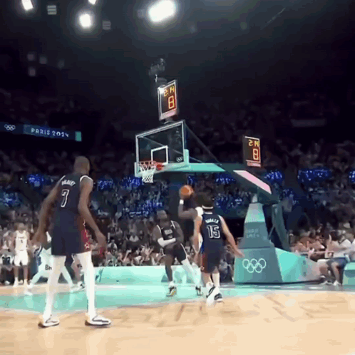 A Basketball Game Is Being Played At The Paris Olympics GIF