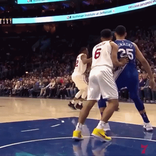 A Basketball Game Is Being Played At The Rothman Institute GIF