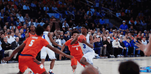 A Basketball Game Is Being Played Between Clemson And Virginia Tech GIF