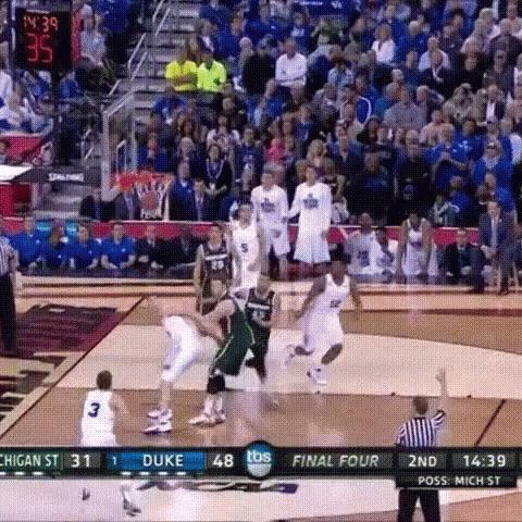 a basketball game is being played between duke and michigan state