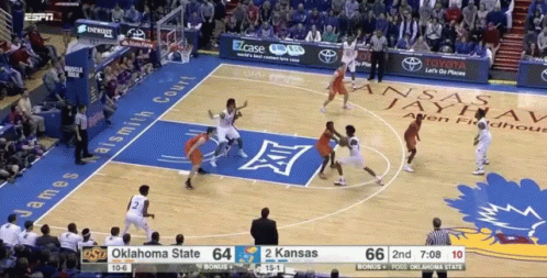 A Basketball Game Is Being Played Between Oklahoma State And Kansas State GIF