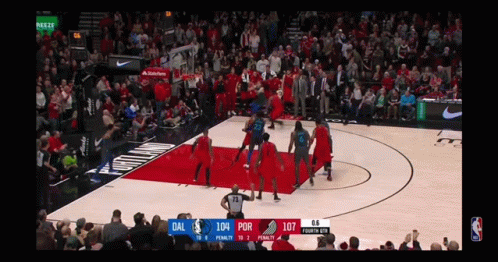 A Basketball Game Is Being Played Between The Dallas And Portland Trail Blazers GIF
