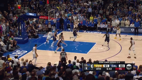 A Basketball Game Is Being Played Between The Dallas Mavericks And The Denver Nuggets GIF