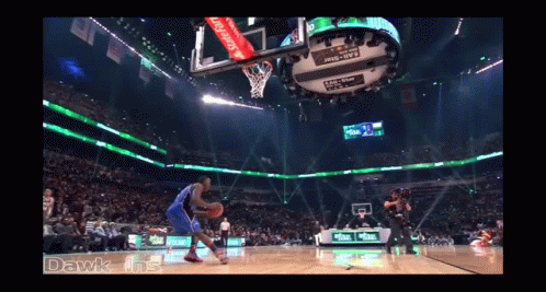 A Basketball Game Is Being Played In A Stadium That Says ' Dawk Ins ' On The Bottom GIF