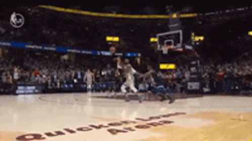 a basketball game is being played in a stadium that says quicken loans on the floor