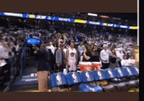 A Basketball Game Is Being Played In A Stadium With A Lot Of People GIF