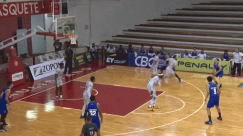 a basketball game is being played in a stadium with a penalty banner