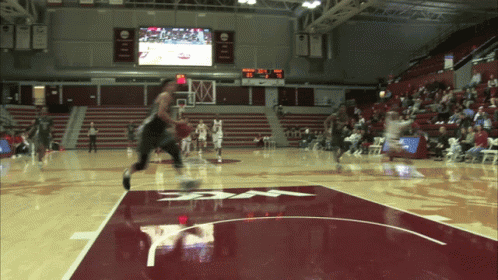 A Basketball Game Is Being Played In A Stadium With A Scoreboard That Says ' Ucsd ' On It GIF
