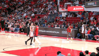 A Basketball Game Is Being Played In A Stadium With A State Farm Ad GIF