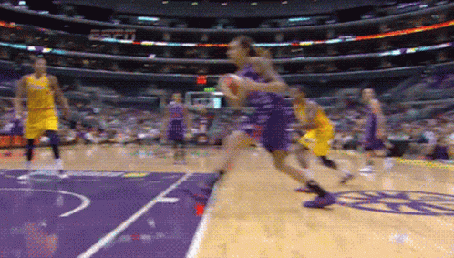 A Basketball Game Is Being Played In A Stadium With Espn On The Wall GIF