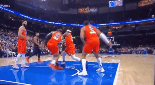 A Basketball Game Is Being Played In A Stadium With The Word Sports On The Bottom GIF