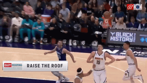 A Basketball Game Is Being Played In Front Of A Banner That Says Black History GIF