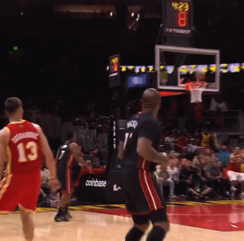 A Basketball Game Is Being Played In Front Of A Coinbase Sign GIF