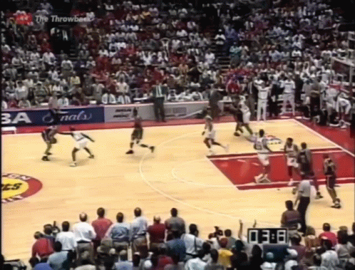 A Basketball Game Is Being Played In Front Of A Crowd And A Scoreboard That Says 3:08 GIF