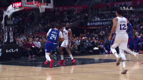A Basketball Game Is Being Played In Front Of A Crowd And A Sign That Says Get The App GIF