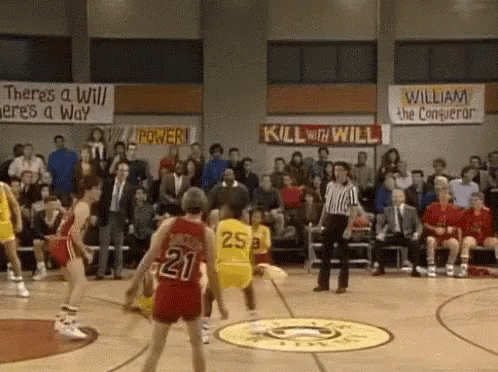 A Basketball Game Is Being Played In Front Of A Crowd And A Sign That Says Kill With Will GIF