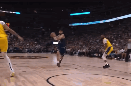 A Basketball Game Is Being Played In Front Of A Crowd And A Sign That Says ' Toyota ' On It GIF