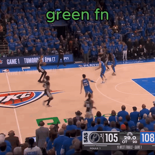 a basketball game is being played in front of a crowd and the scoreboard says 108