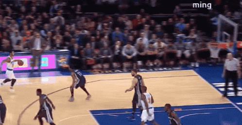 A Basketball Game Is Being Played In Front Of A Crowd And The Word Ming Is On The Bottom Right GIF