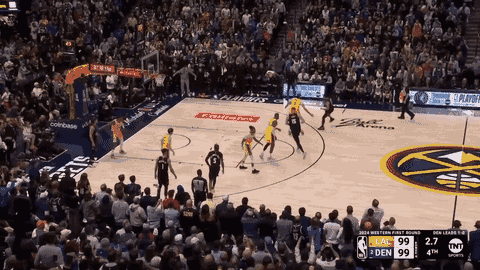 A Basketball Game Is Being Played In Front Of A Crowd Sponsored By Coinbase And Tnt Sports GIF