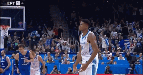 A Basketball Game Is Being Played In Front Of A Crowd That Is Cheering For Their Team GIF