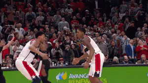 A Basketball Game Is Being Played In Front Of A Crowd That Is Sponsored By Avanti GIF