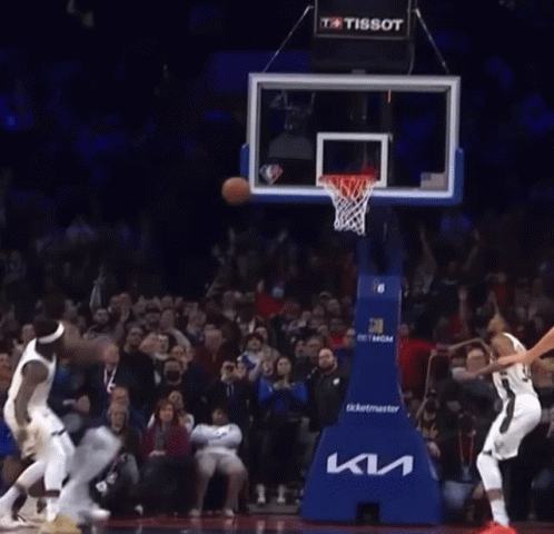 A Basketball Game Is Being Played In Front Of A Crowd That Is Sponsored By Tissot GIF