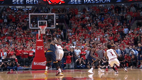 A Basketball Game Is Being Played In Front Of A Crowd That Is Wearing Red GIF