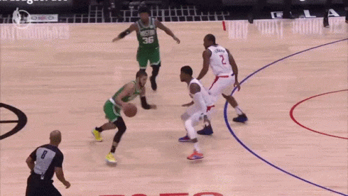 a basketball game is being played in front of a crowd that says les te