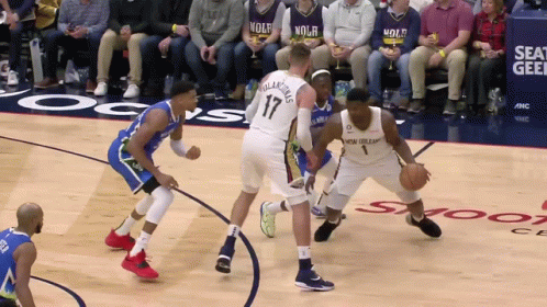 A Basketball Game Is Being Played In Front Of A Crowd Wearing Nolh Jerseys GIF