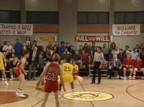 A Basketball Game Is Being Played In Front Of A Crowd With A Banner That Says Kill With Will GIF