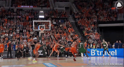 A Basketball Game Is Being Played In Front Of A Crowd With A Btraveler Ad In The Corner GIF