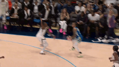 A Basketball Game Is Being Played In Front Of A Crowd With A Tnt Logo In The Corner GIF