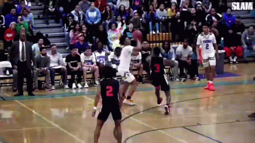 A Basketball Game Is Being Played In Front Of A Crowd With One Player Wearing The Number 2 GIF