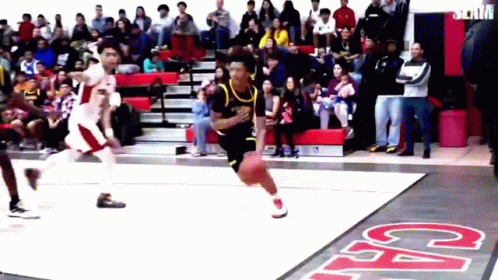 A Basketball Game Is Being Played In Front Of A Crowd With The Word Cal On The Floor GIF