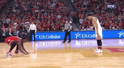 A Basketball Game Is Being Played In Front Of A Crowd With Us Cellular Advertisements GIF