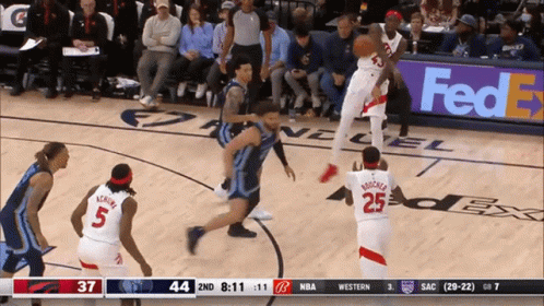 A Basketball Game Is Being Played In Front Of A Fedex Banner GIF