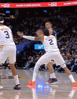 A Basketball Game Is Being Played In Front Of A Hometown Banner GIF