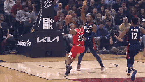 A Basketball Game Is Being Played In Front Of A Keybank Advertisement GIF