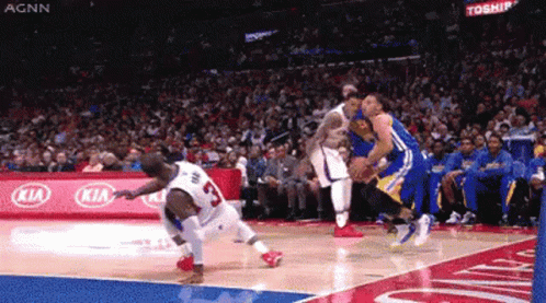 A Basketball Game Is Being Played In Front Of A Kia Sign GIF