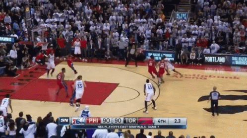 A Basketball Game Is Being Played In Front Of A Large Crowd GIF